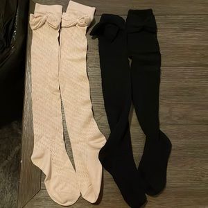Tan and black leg warmers with bow